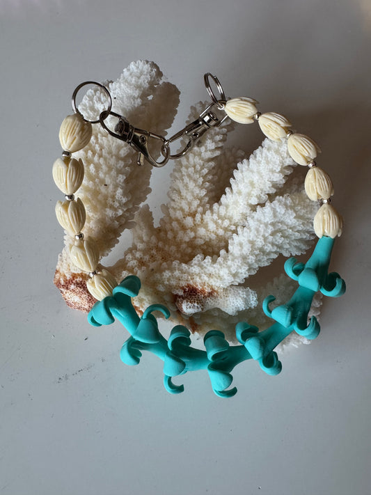Teal Puakenikeni Purse Lei (silver hardware)