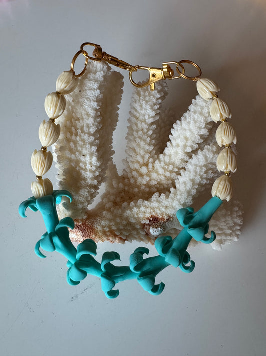Teal Puakenikeni Purse Lei
